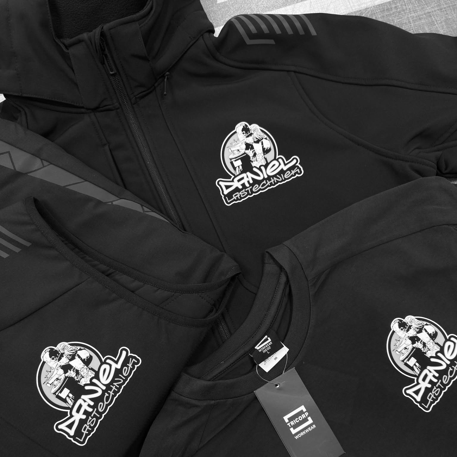 Daniel Lastechniek logo full colour bedrukt op softshell en werkshirts